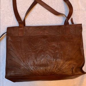 Leaders in leather tooled tote